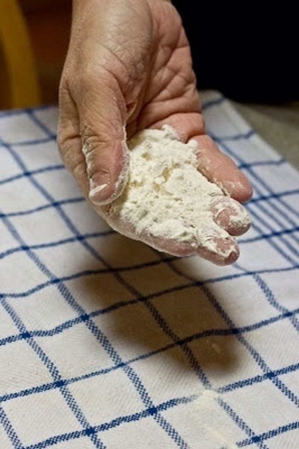 Flour a clean cotton dishcloth.