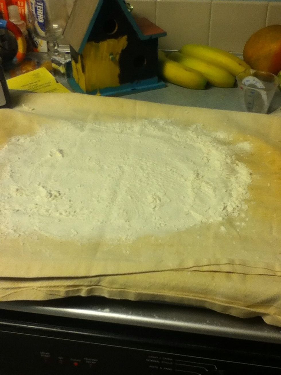 Flour a pastry cloth and throw the dough on it.