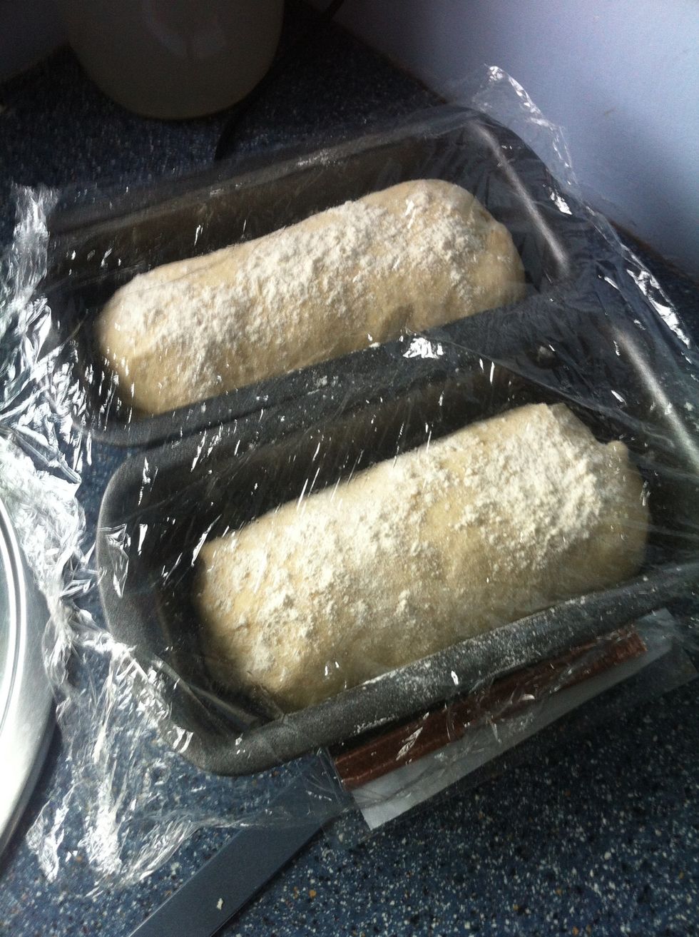 Flour and cover then leave to rise in a warm place. The flour is to stop the dough from sticking to the 'Cling Film'.