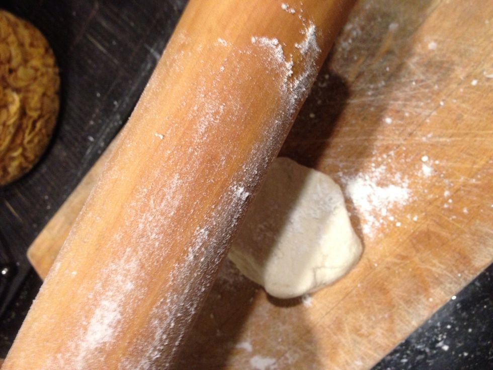 Flour rolling pin and suface so dough does not stick while rolling it.