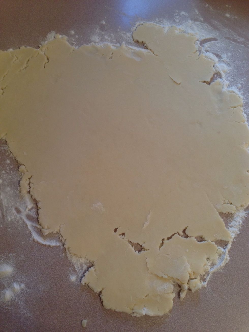 Flour the working area and start rolling out the chilled cookie dough.