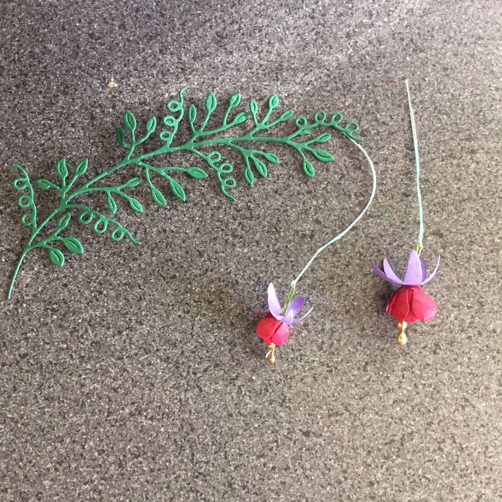 Flowers and leaves for front decoration.  Stick the flowers in place on the back of the design (a glue gun is easiest in this case), so that just the flowers show hanging down, cut off excess cotton.