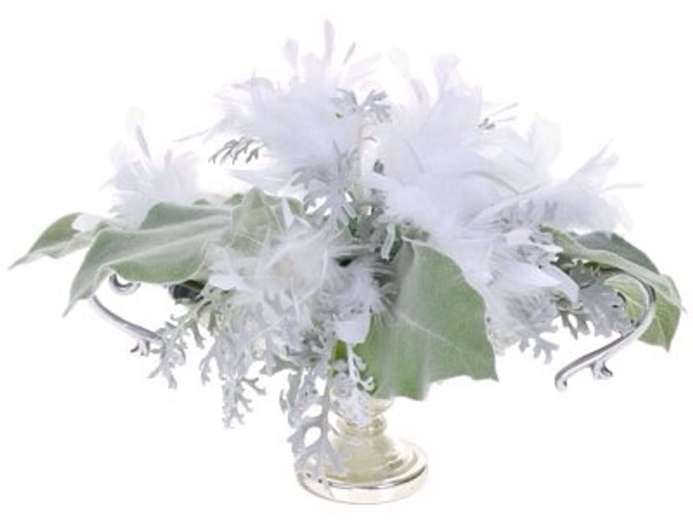 Fluffy white feathers add delicate movement and a touch of femininity to the design. Place them in between the greens to fill out the form.