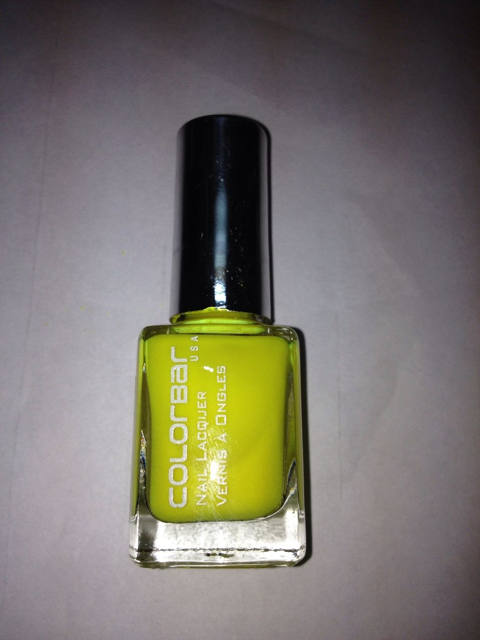 Fluorescent polish. Again, it looks a lot darker and less brighter than its actual colour. Paint a little more than half your nail with this colour.