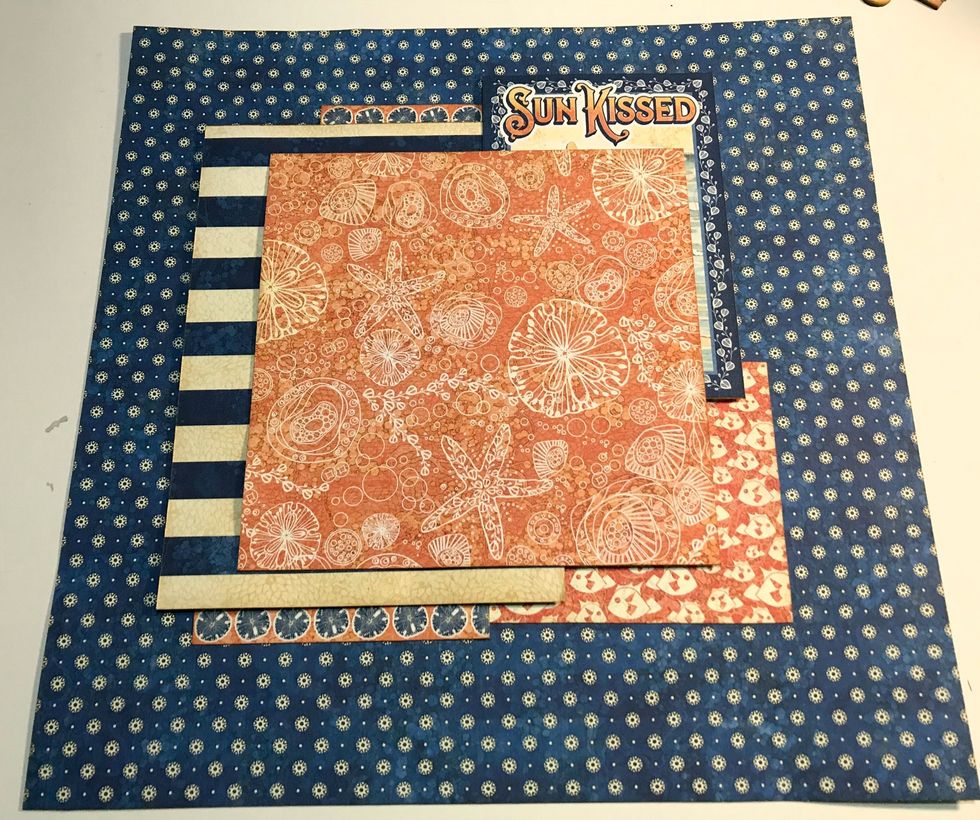 Foam square large striped paper 2 1/2" from left & 1 3/4" from top. Foam square 4x6 card 2 1/8" from left & 1" from top. Adhere 6" shell paper 2 1/4" from top & 2 3/4" from right of paper.