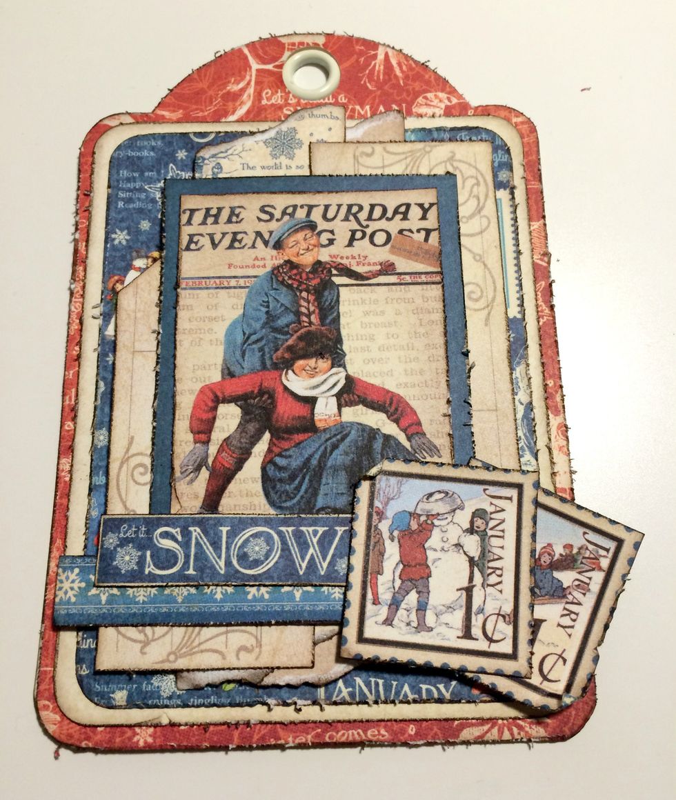 Foam square one postage stamp to the bottom right hand corner. Adhere the second postage stamp slightly overtop of the first stamp. Roll the corners down and up on the postage stamps.