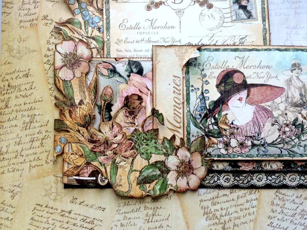 Foam square the last flower bunch partially overtop of the memories and rose card. It will cover the car, only showing parts of it as well the bottom of the floral bunch will go past the lace border.