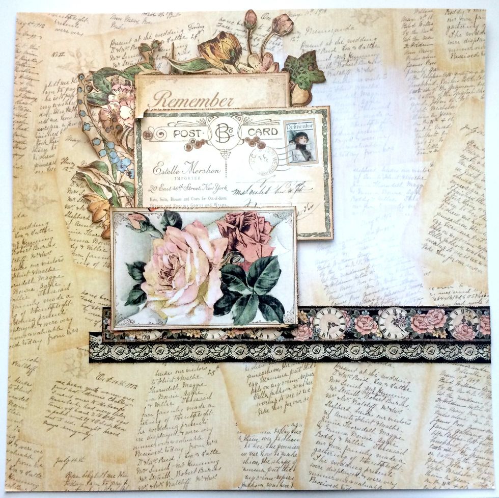 Foam Square the postcard with the "Remember" to the top left hand corner overtop of the flowers. Adhere the top and foam square the bottom of the rose card to the third line of the post card.