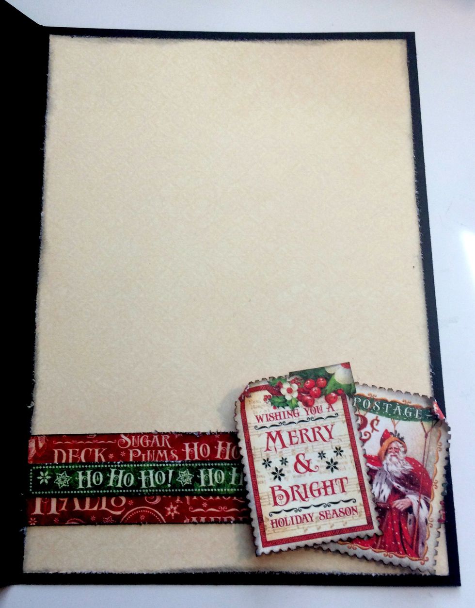Foam square the stamps in the bottom right hand corner of the border. Roll one of the corners down on each stamp. The inside of your card is now finished.