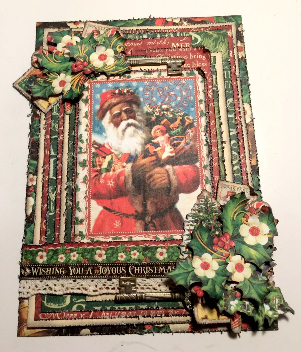 Foam square three holly bunches overtop of the stamps and candy canes.