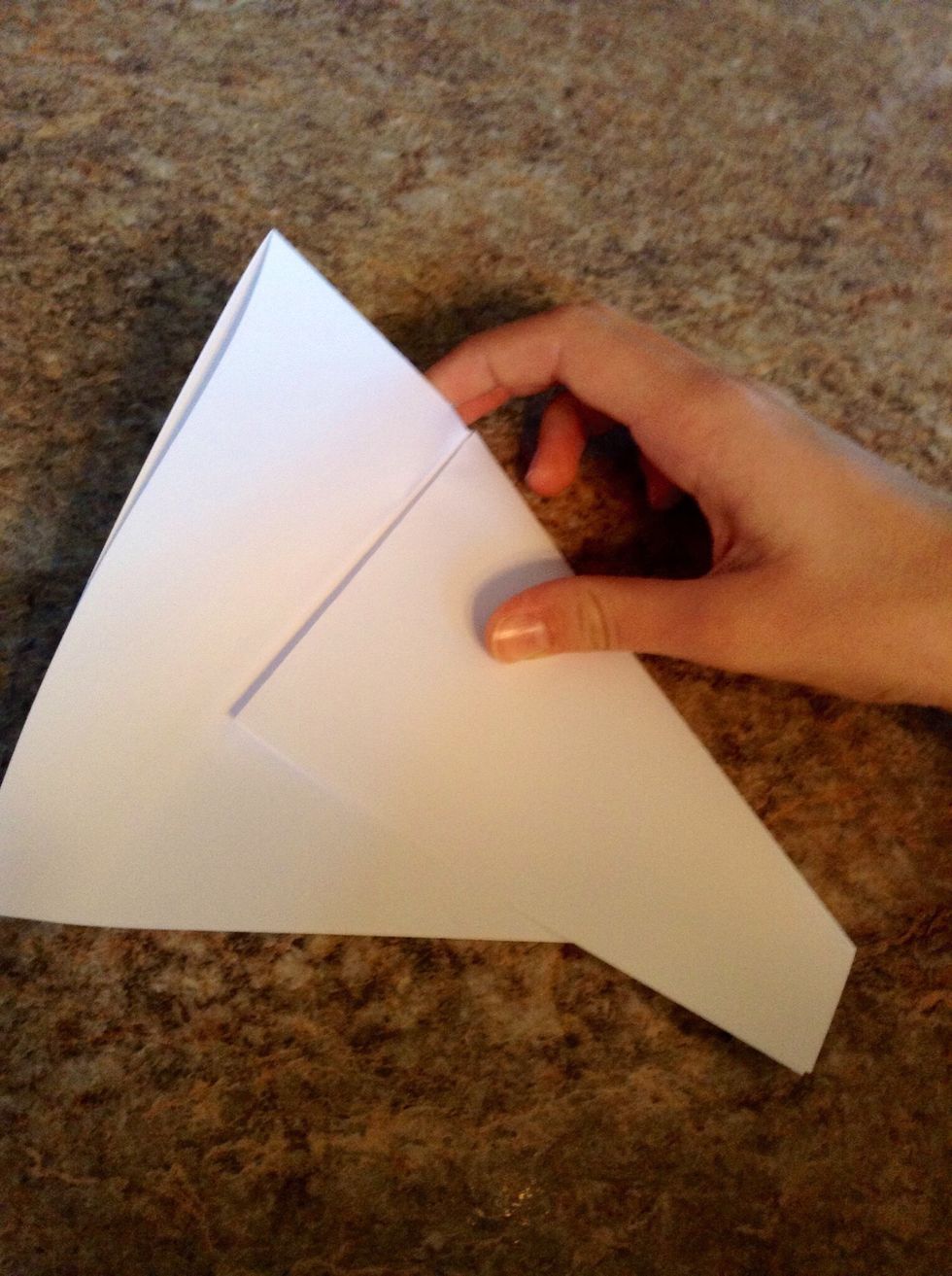 Fold 1/3 over diagonally, and repeat on the remaining side. If uneven, adjust.