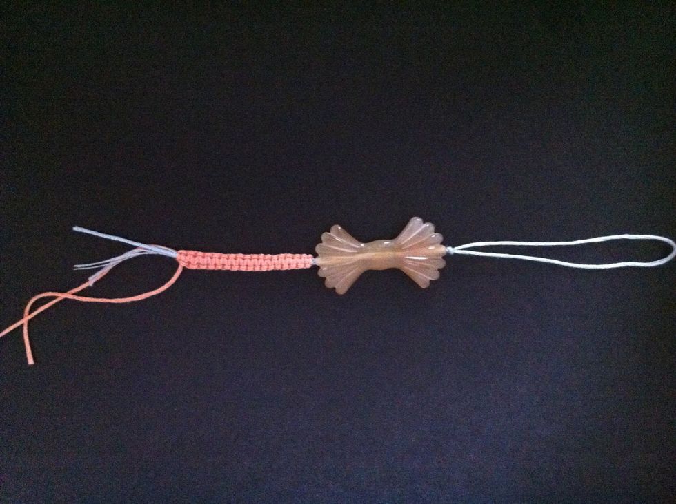 Fold 1x 20cm blue cord in half and string charm onto doubled up cord. Place charm at center and knot at either end so it stays in place. My apologies for not taking a picture at an earlier stage.