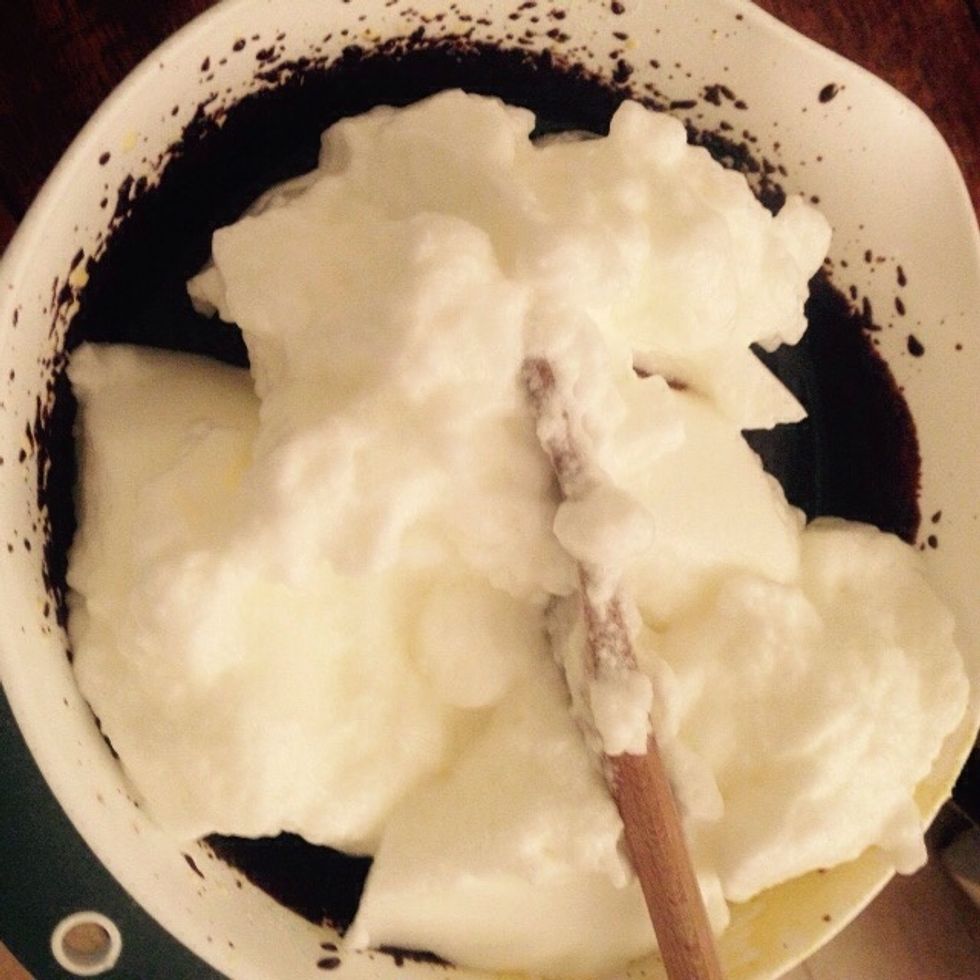 Fold 2/3 of the whites into the chocolate based mix