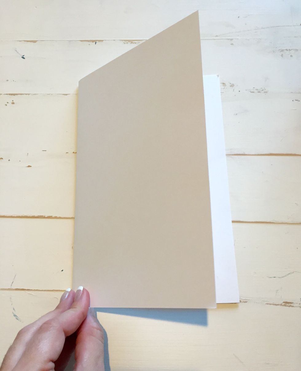Fold a 8.5 x 11 piece of cardstock in half to create a card base.