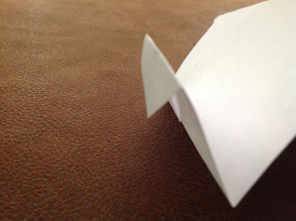 Fold a little bit down on each wing at the corner. Now it's ready to fly!