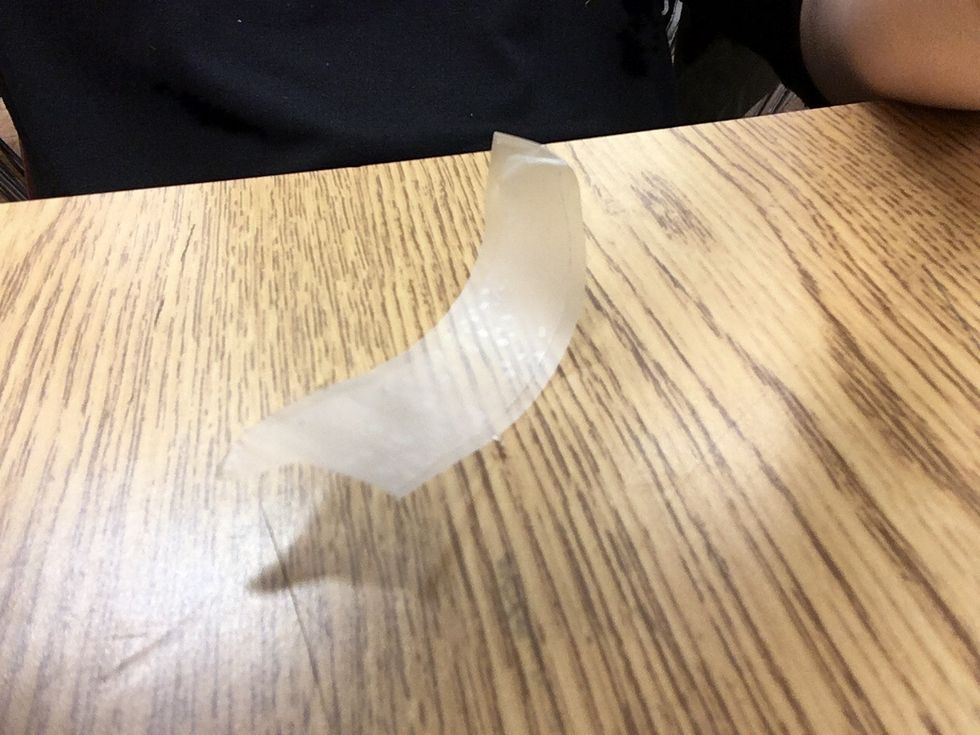 Fold a long piece of tape over on itself