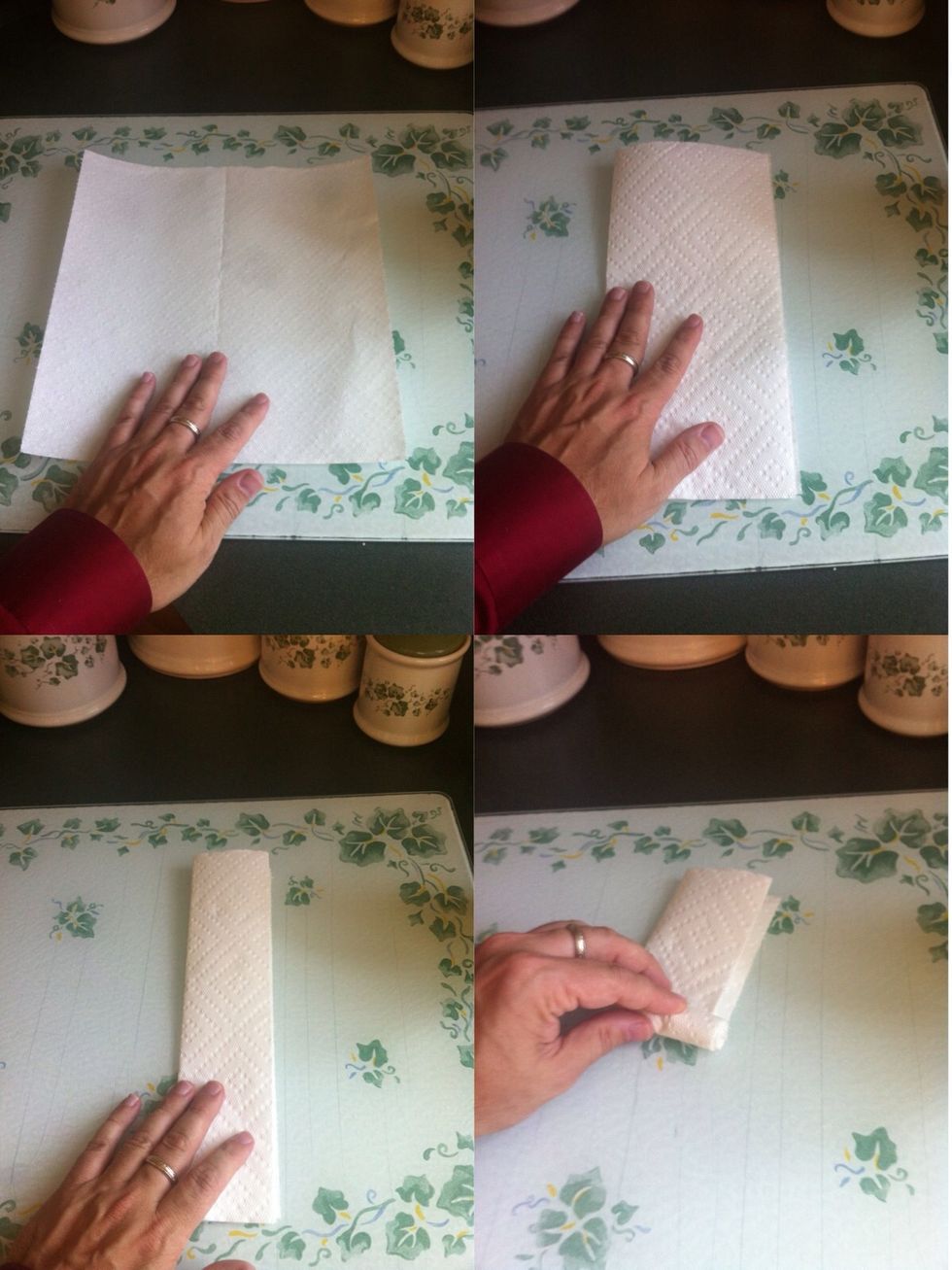 Fold a paper towel in half, and in half again, then roll it up into a tight roll.