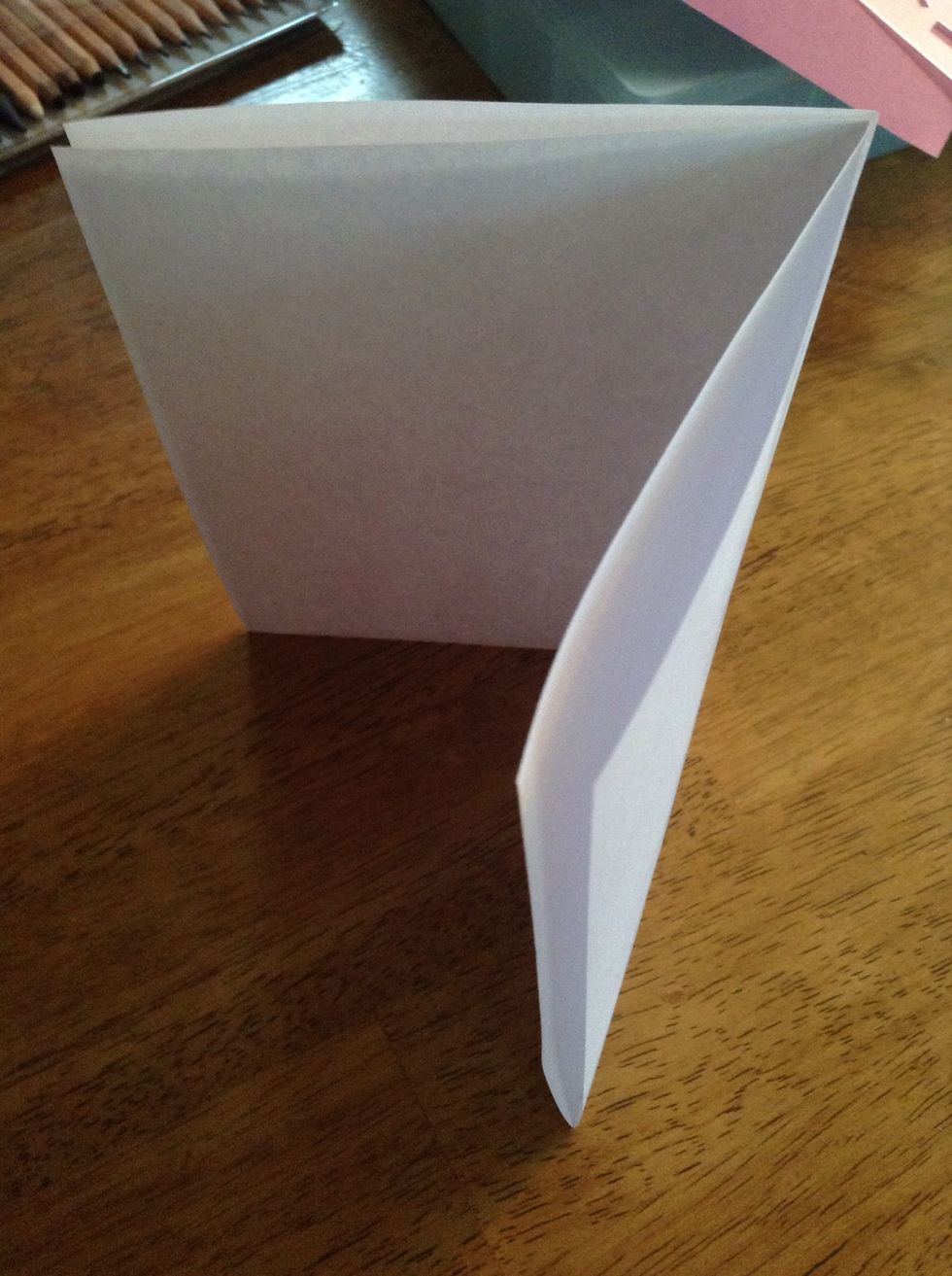 Fold a piece of plain, white paper in half 2 times, so you have a nice card shape.