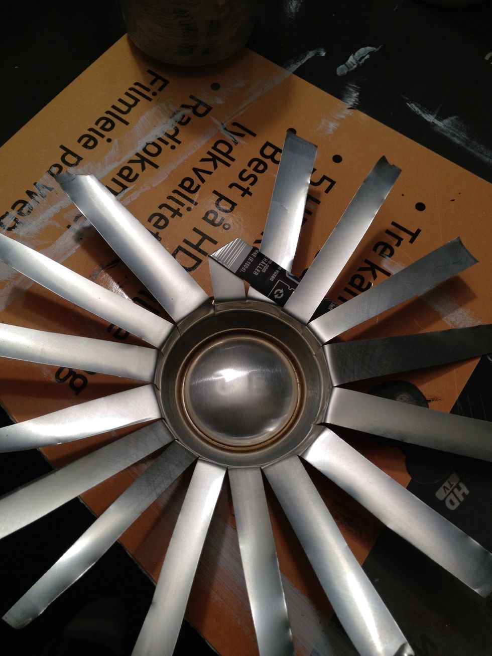 Fold a strip to go over the first one, and under the second.