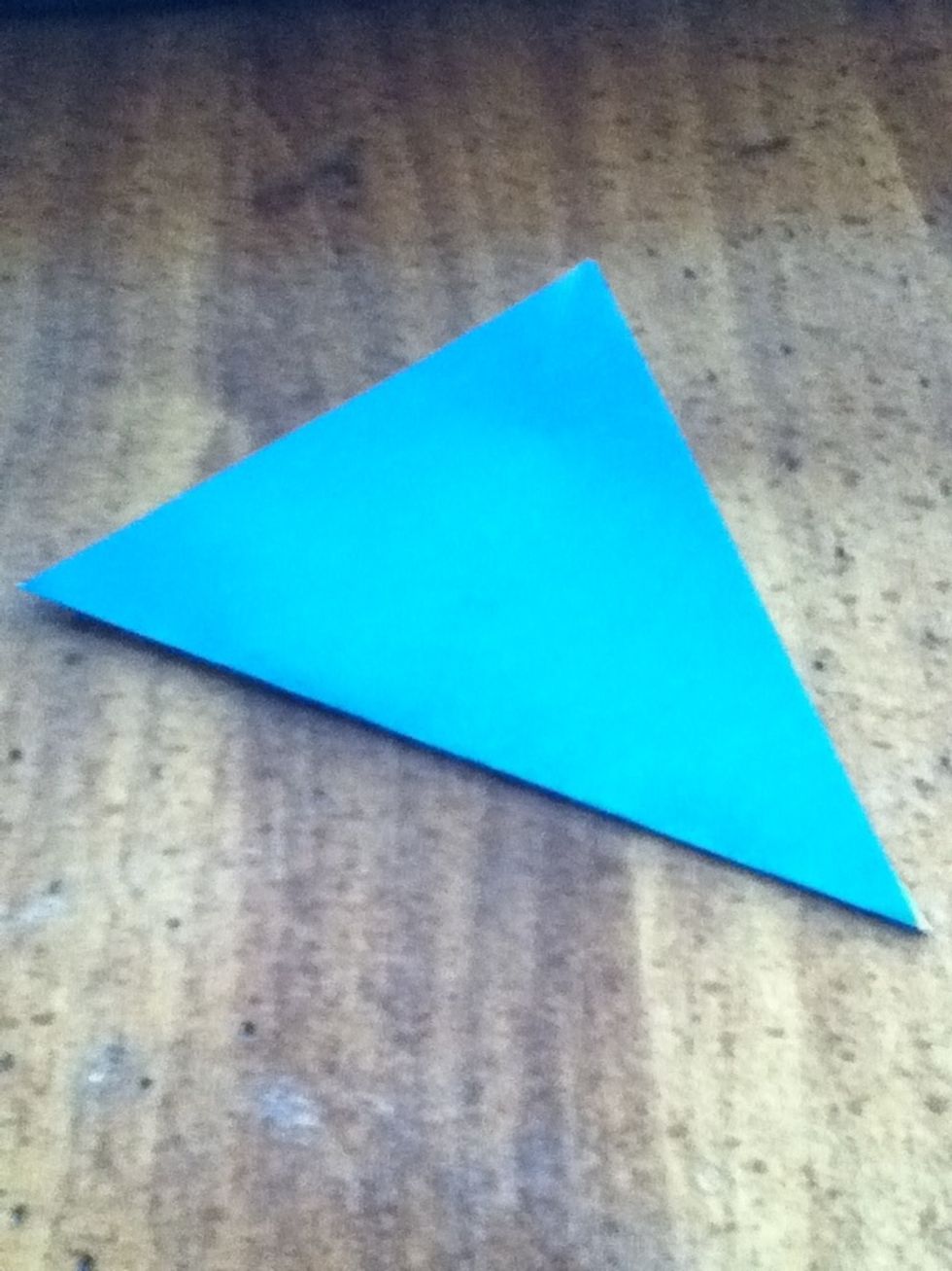 Fold again, but by the other corners.