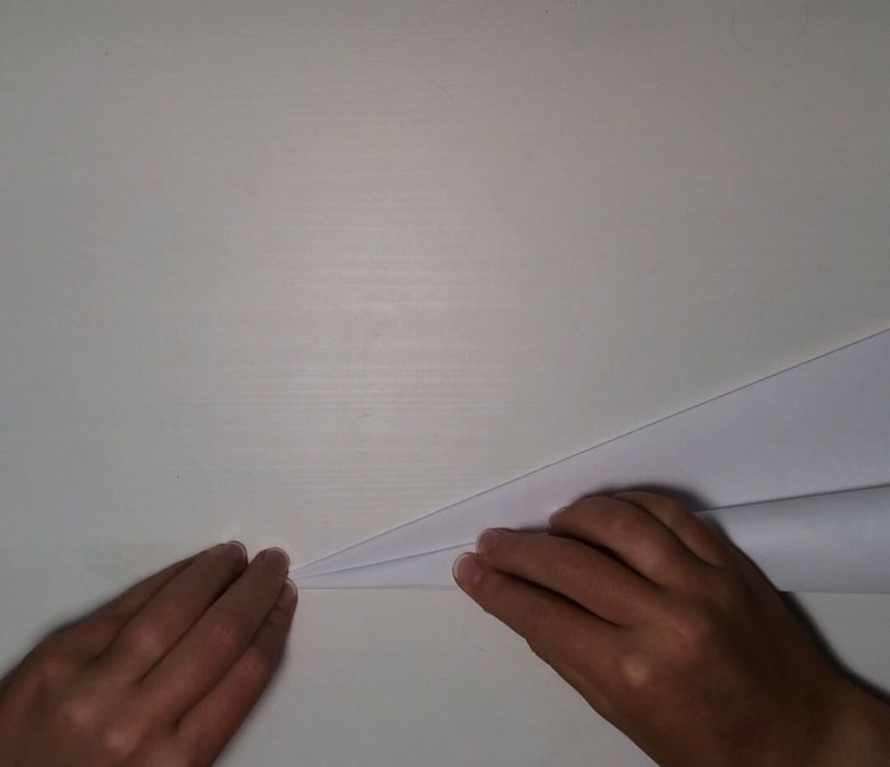 Fold again diagonally.