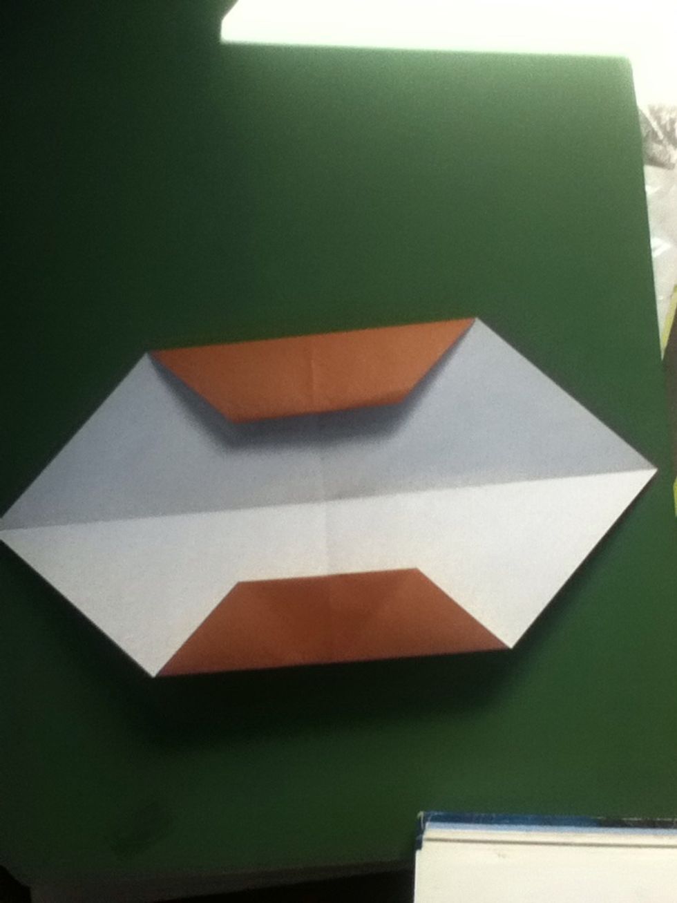 Fold again using the existing creases