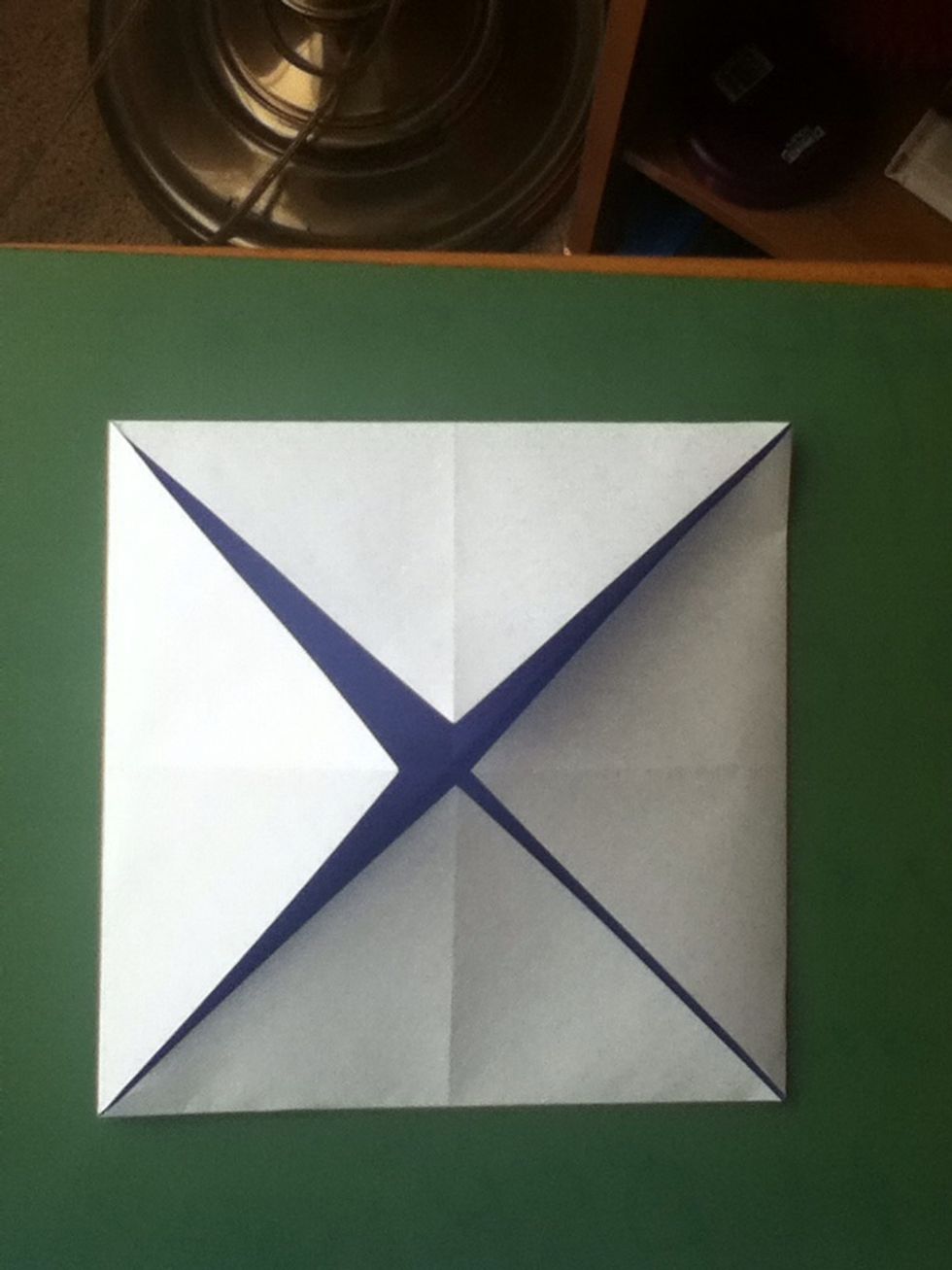 Fold all corners into the center