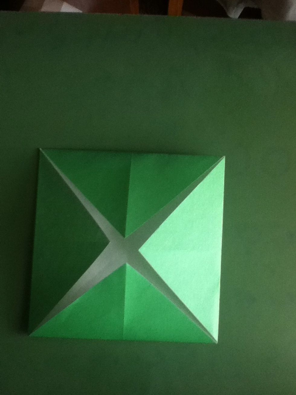 Fold all corners into the center
