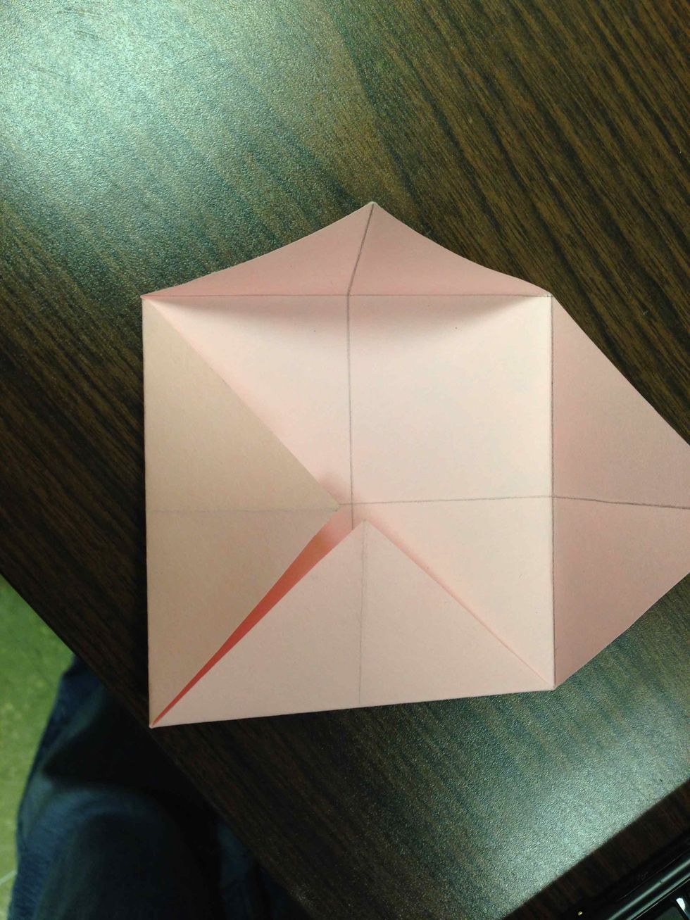 Fold all corners to middle.