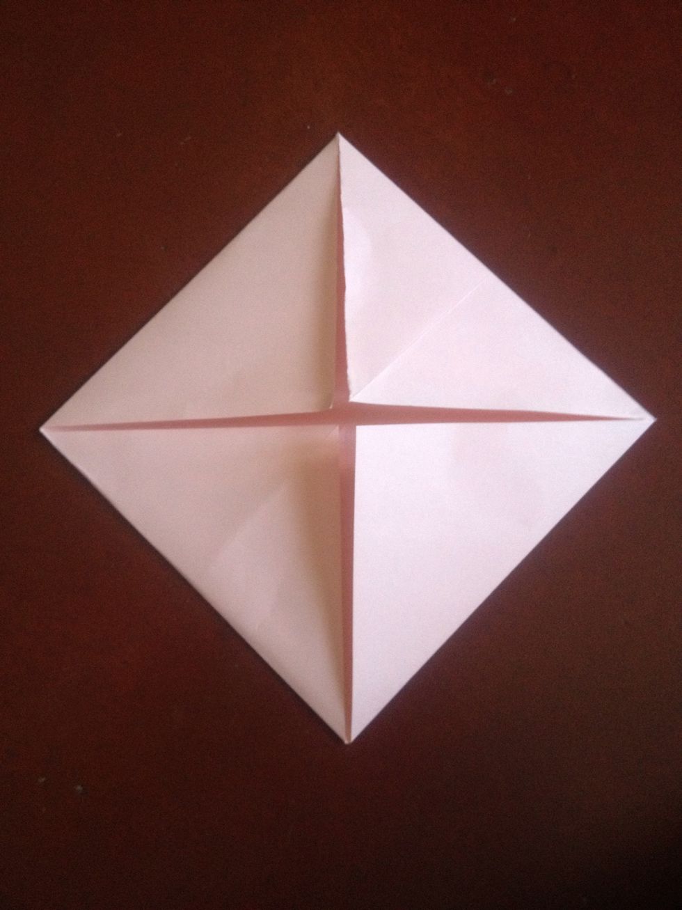 Fold all four corners to the center..