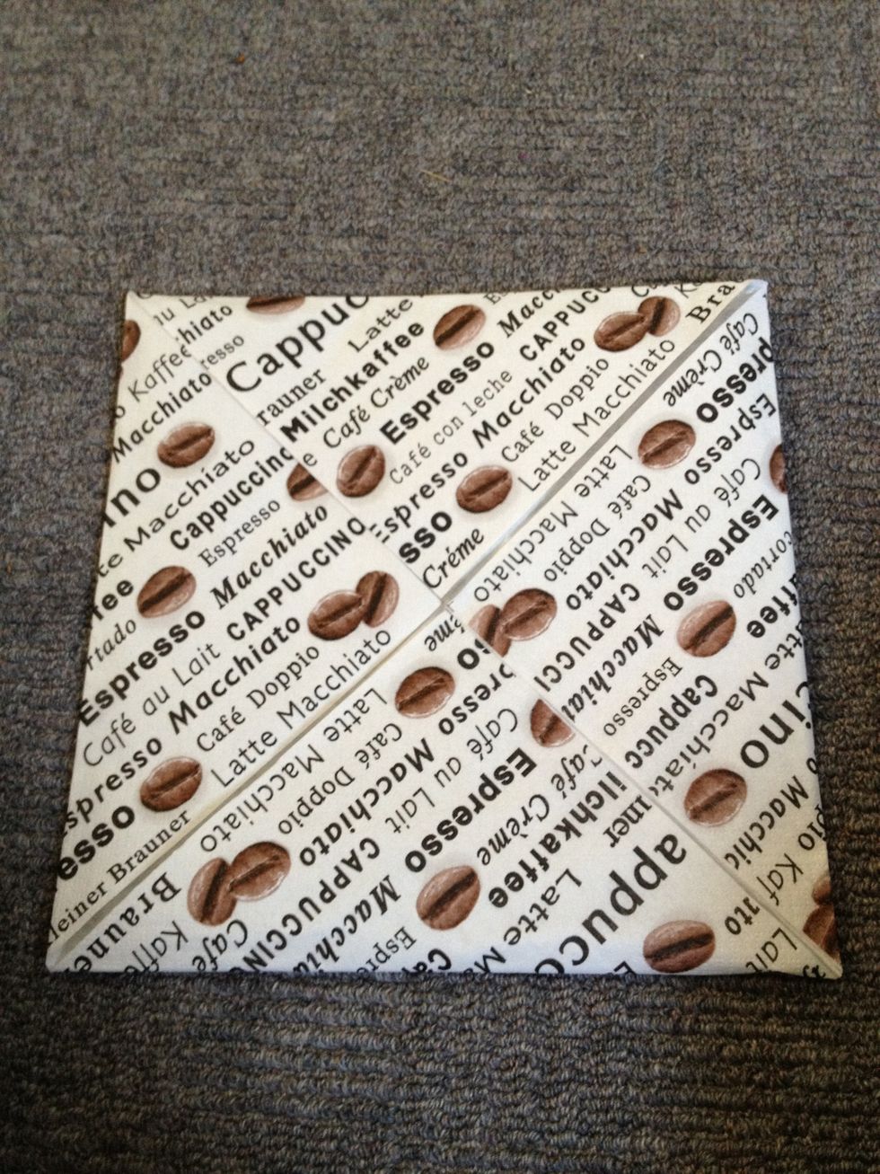 Fold all of the corners to the middle.