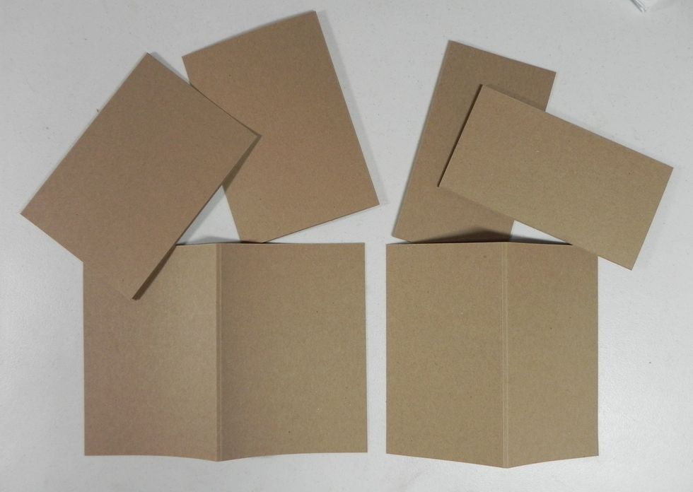 Fold all pages on the score lines (going the same direction).