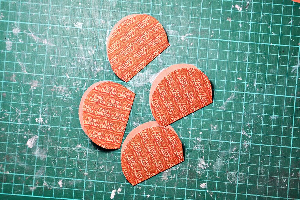 Fold all pumpkin shapes in half.