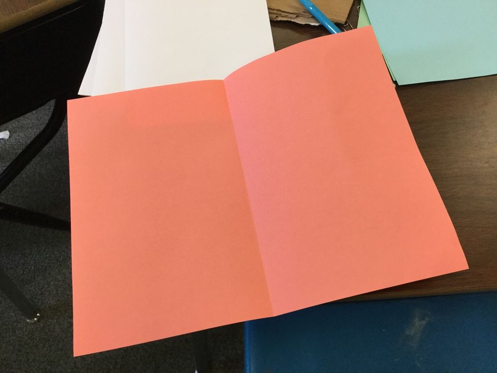 Fold all ten papers and cover in half one by one