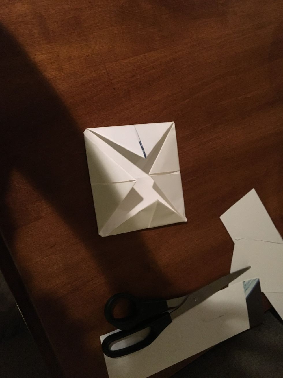 Fold all the corners in again