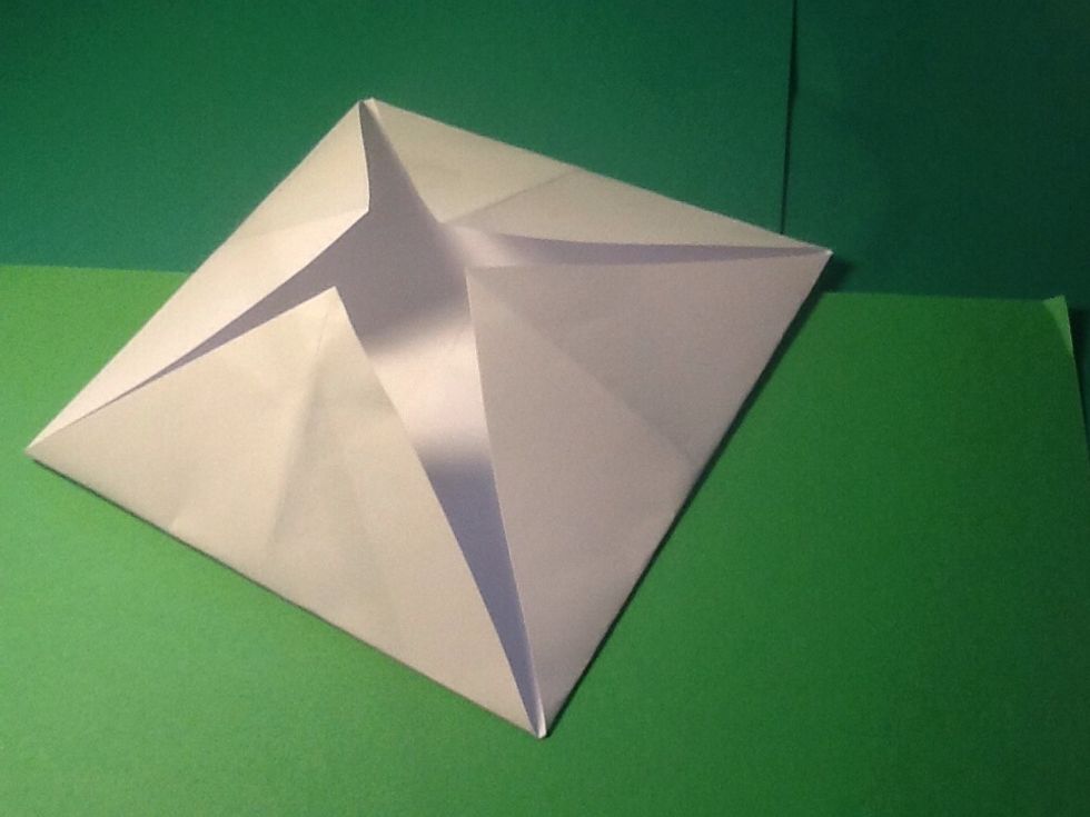 Fold all the corners in to the middle