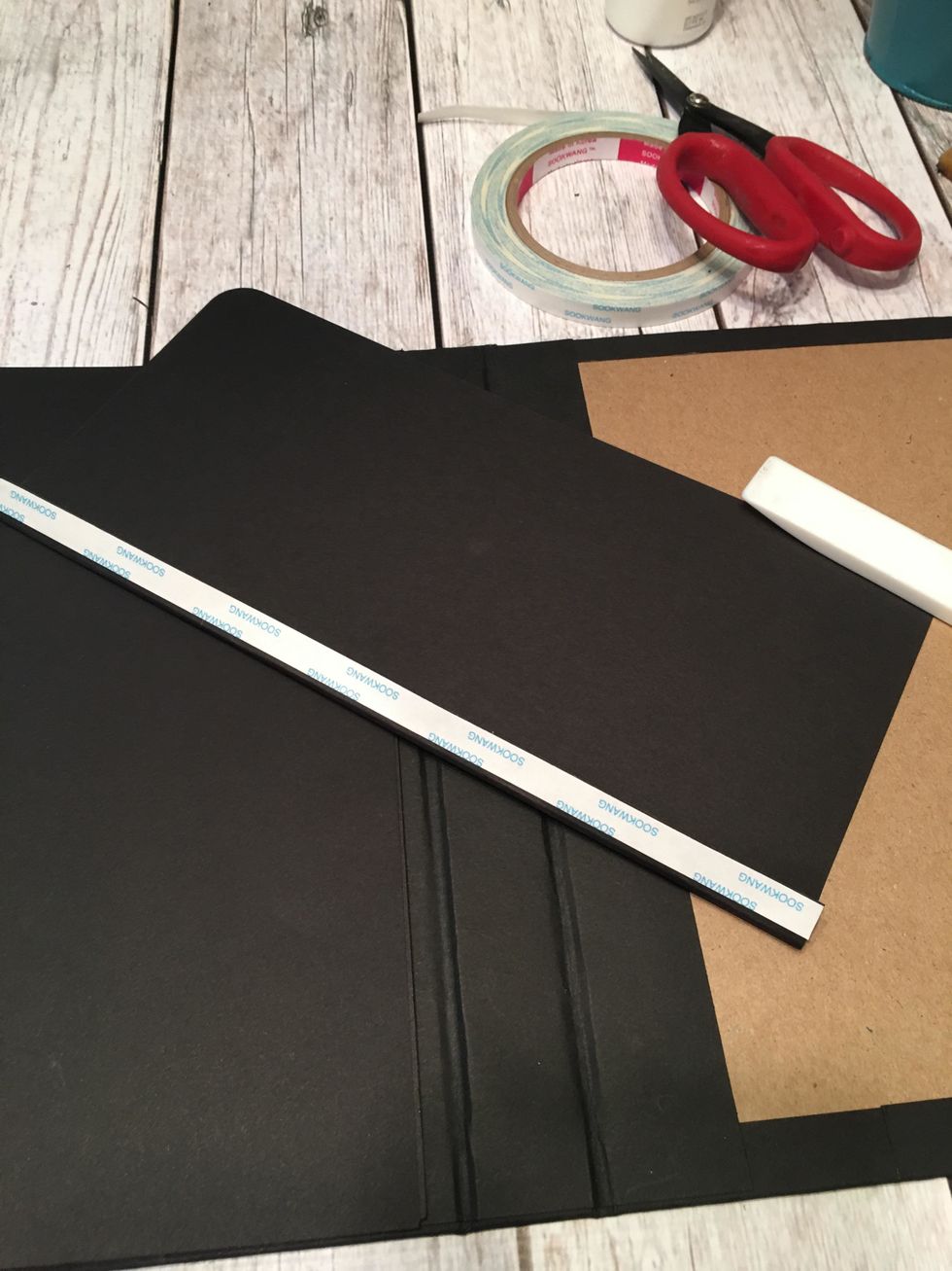 Fold and burnish the score line and apply 3/8" scor-tape to the hinge as shown.
