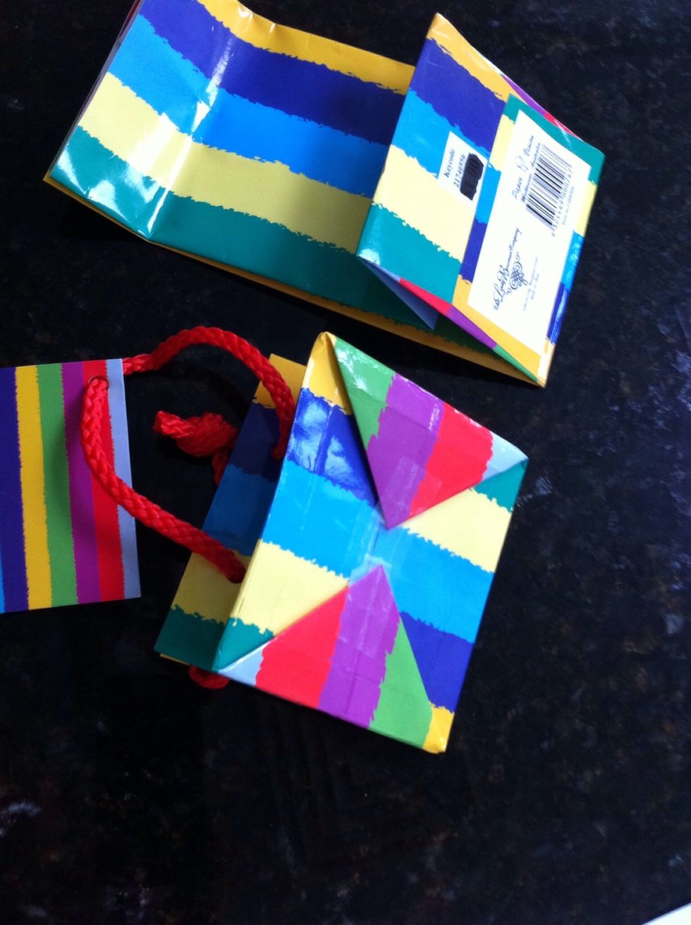 Fold and compress the bag until it folds flat, Sellotape across bottom (Sellotape across the bottom on the inside as well if you feel it necessary.)