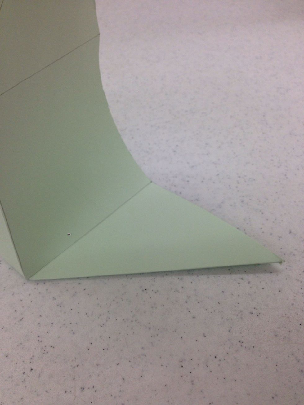 Fold and crease each diagonal line. Be sure the fold does not extend into the base of the basket.