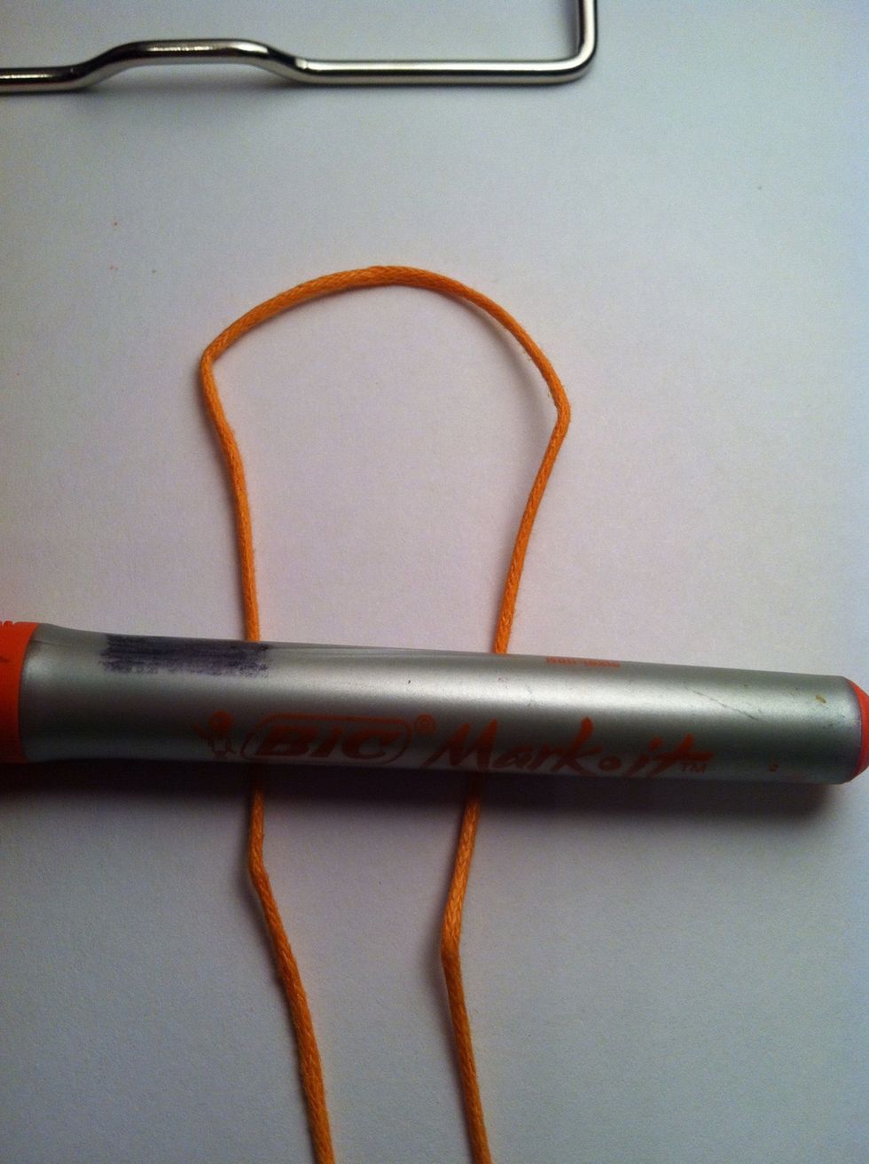 Fold and create loop. Place behind the object.