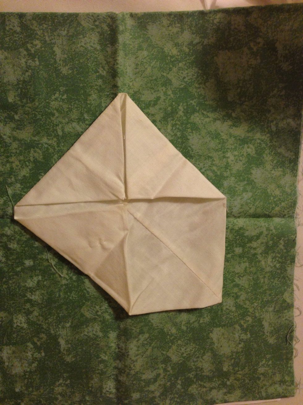 Fold and iron the sides down. Sew down all the points in the middle.