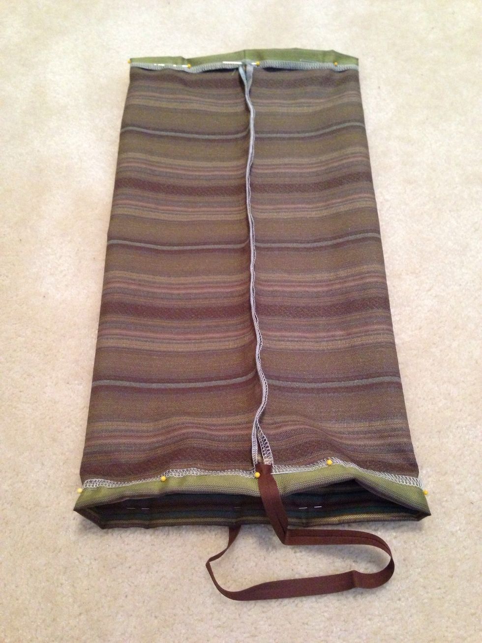 Fold and pin top & bottom edges approximately 3/4" to create loop for elastic. Pin bias tape to one edge. I pin tape at 180 degrees because it will hang straight but you can pin together instead.