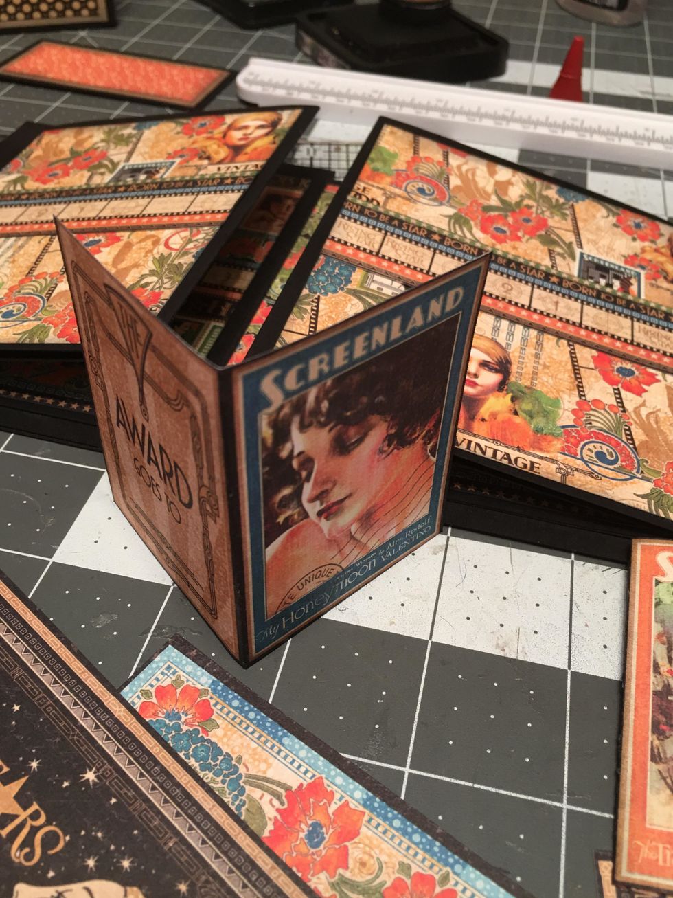 Fold and score in half some of the cut apart images to create mini booklets.