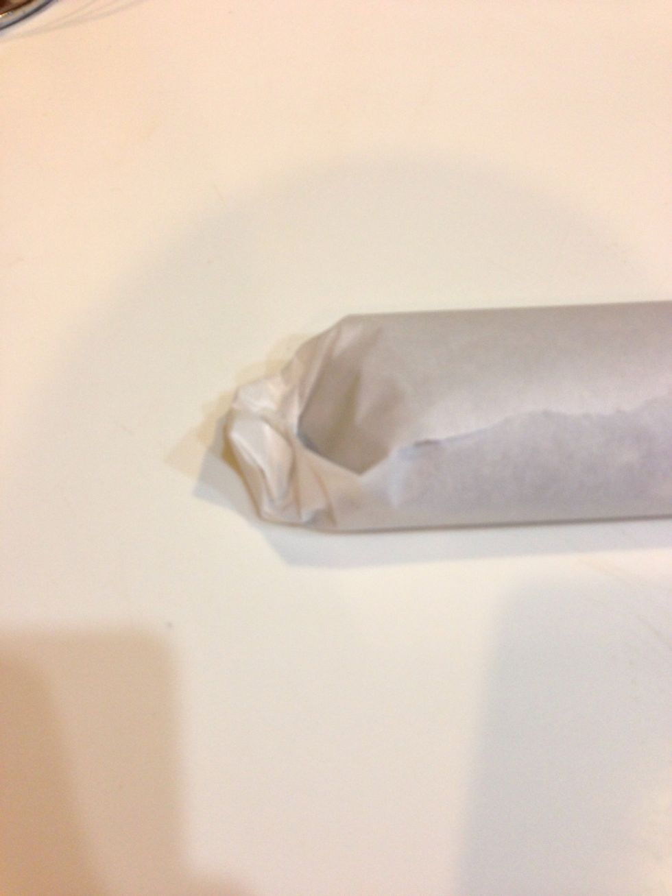 Fold and tuck your edges so the parchment paper will stay rolled.