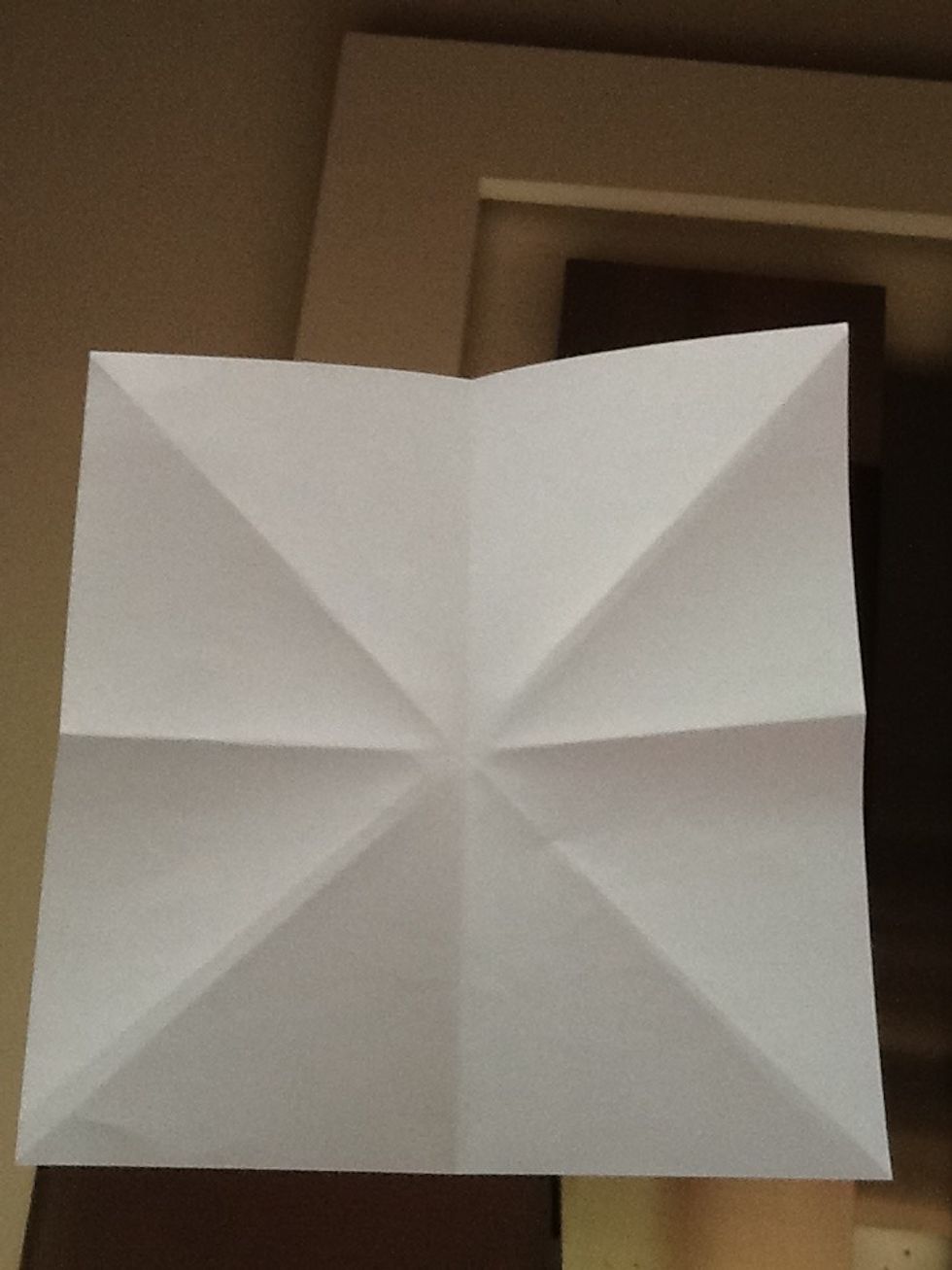 Fold another half, this is what it should look like when you open the paper