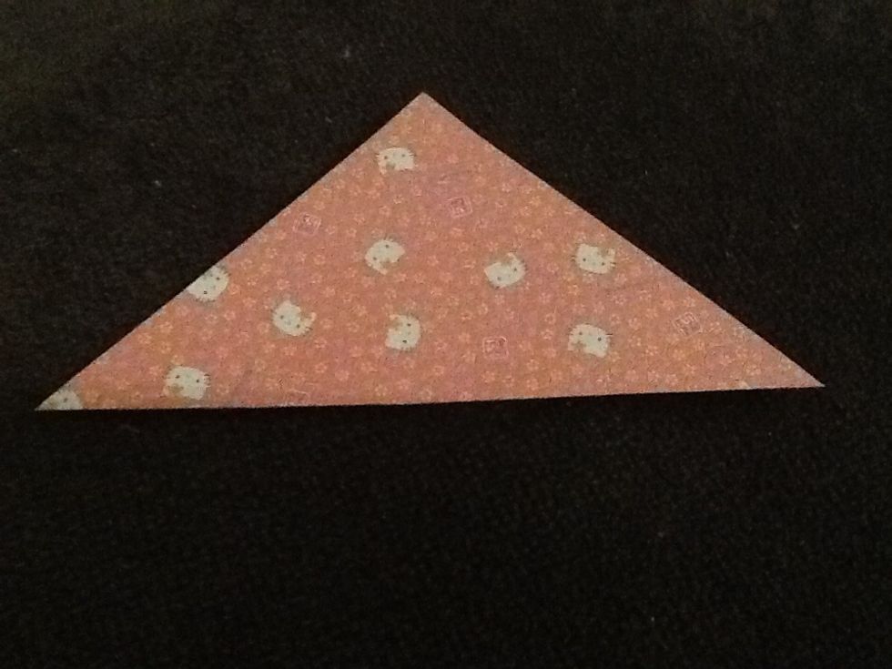 Fold any corners opposite each other so you make a triangle