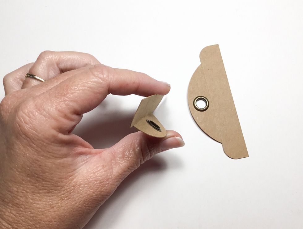 Fold as shown. These will become the flaps that hold the album closed.