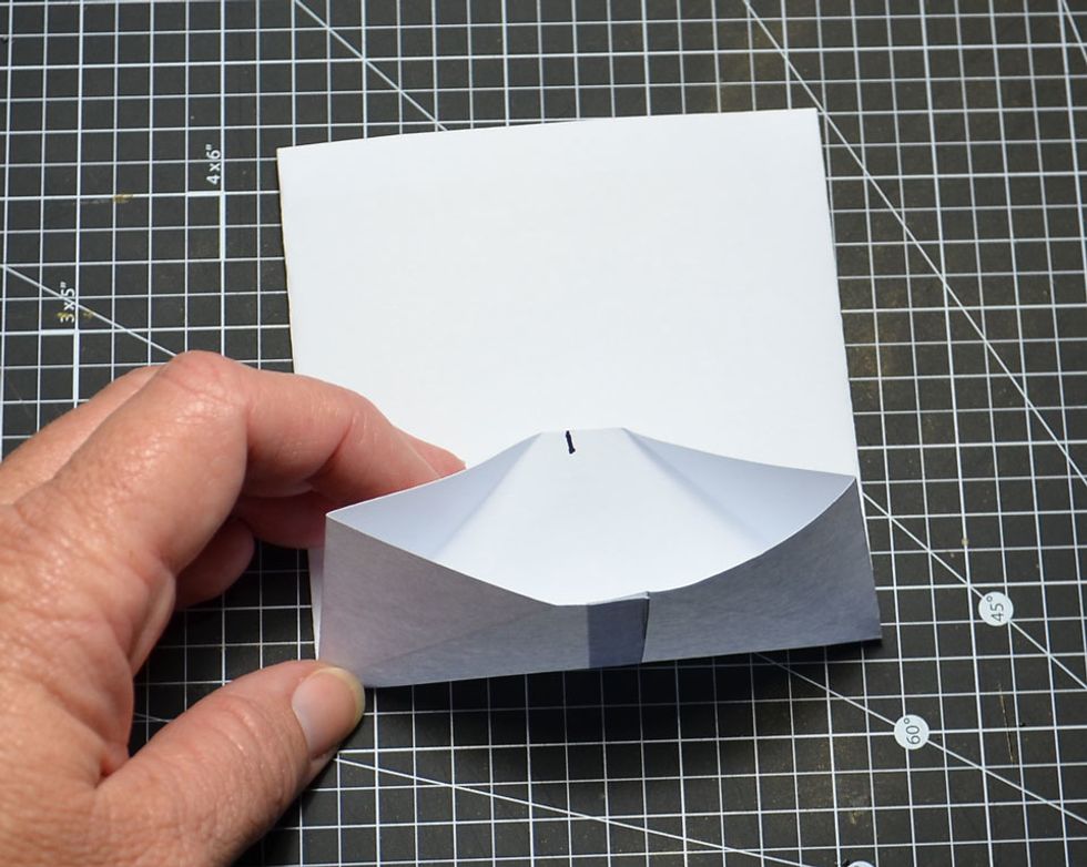 Fold back and unfold as shown.