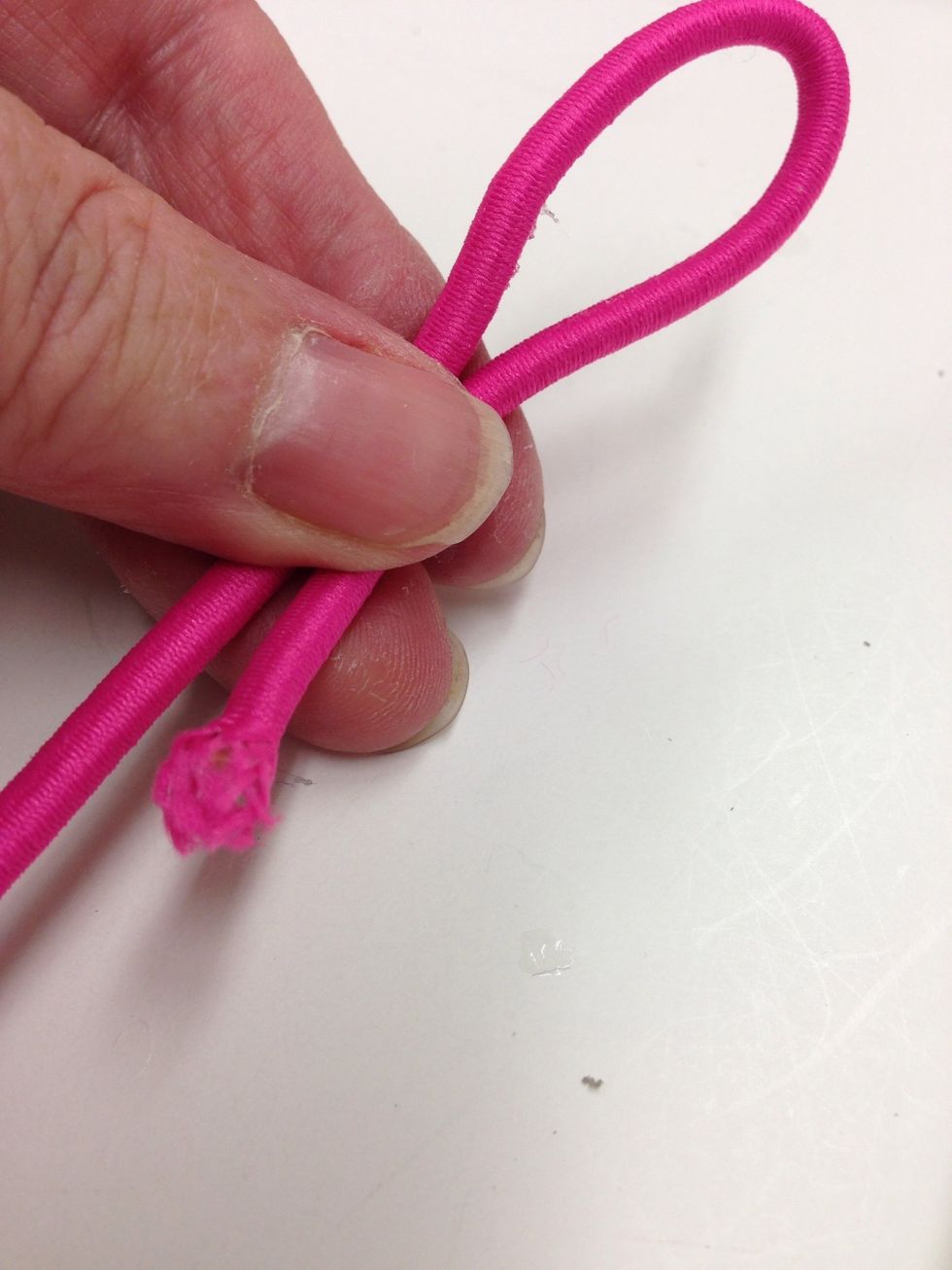 Fold back approximately 4" on one end of one of your 15" bungee cords.