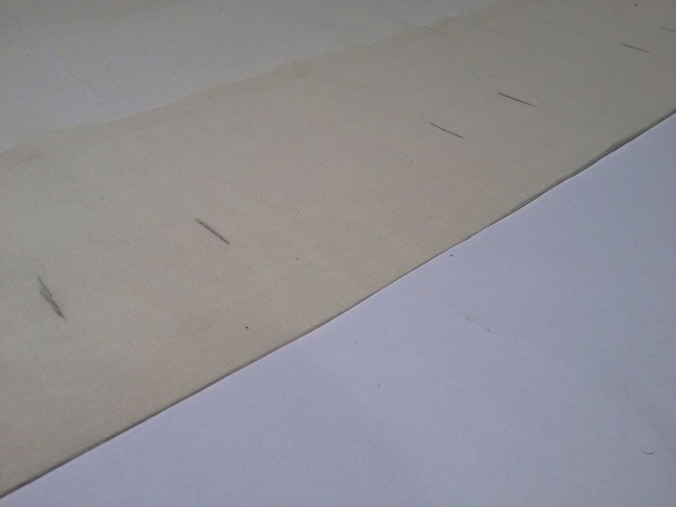 Fold back down the 8-1/2 inches and press over the buttonholes so that the two layers adhere to each other.